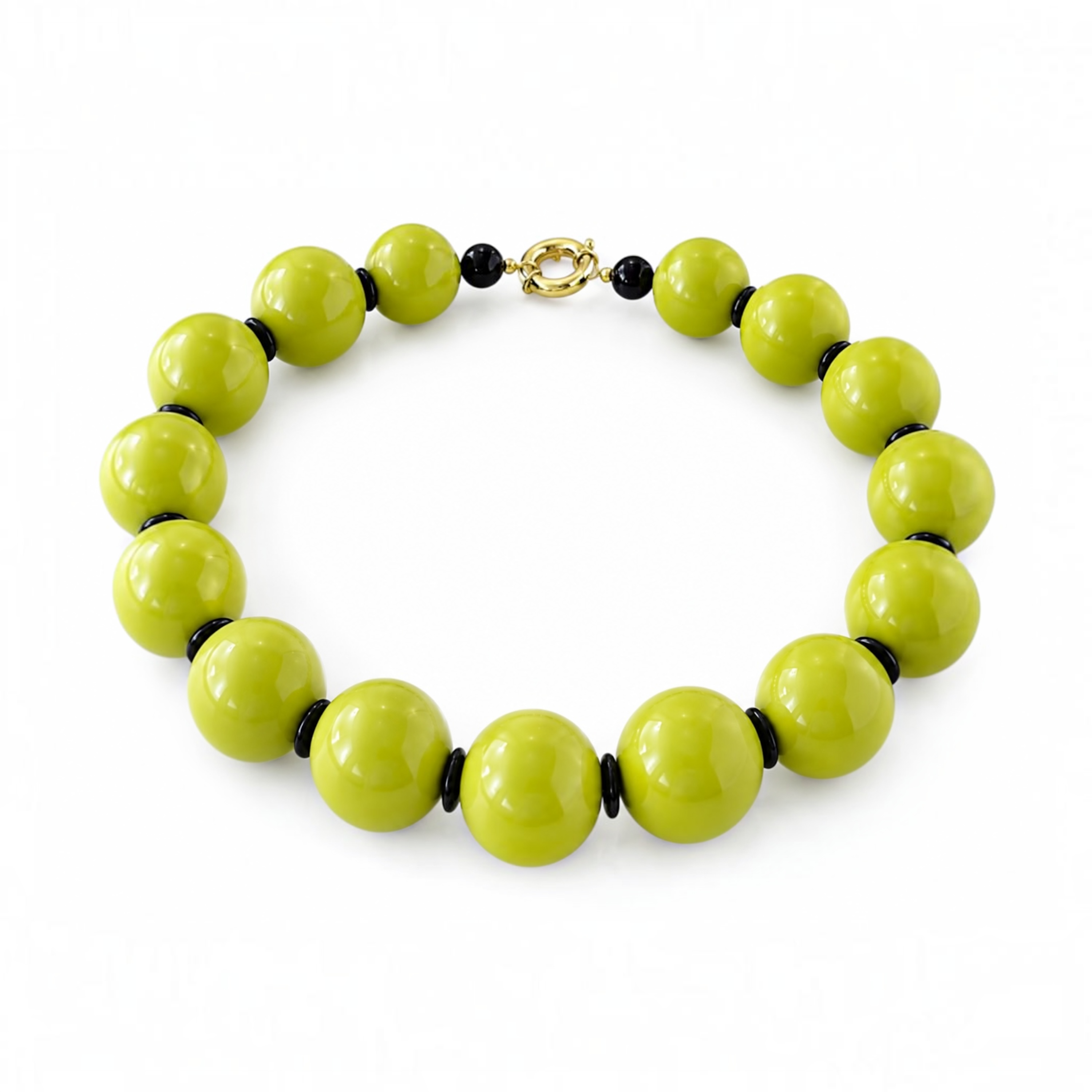 A beaded necklace with large glossy lime green beads separated by small black spacer beads, finished with a gold-toned clasp, shown on a plain white background.