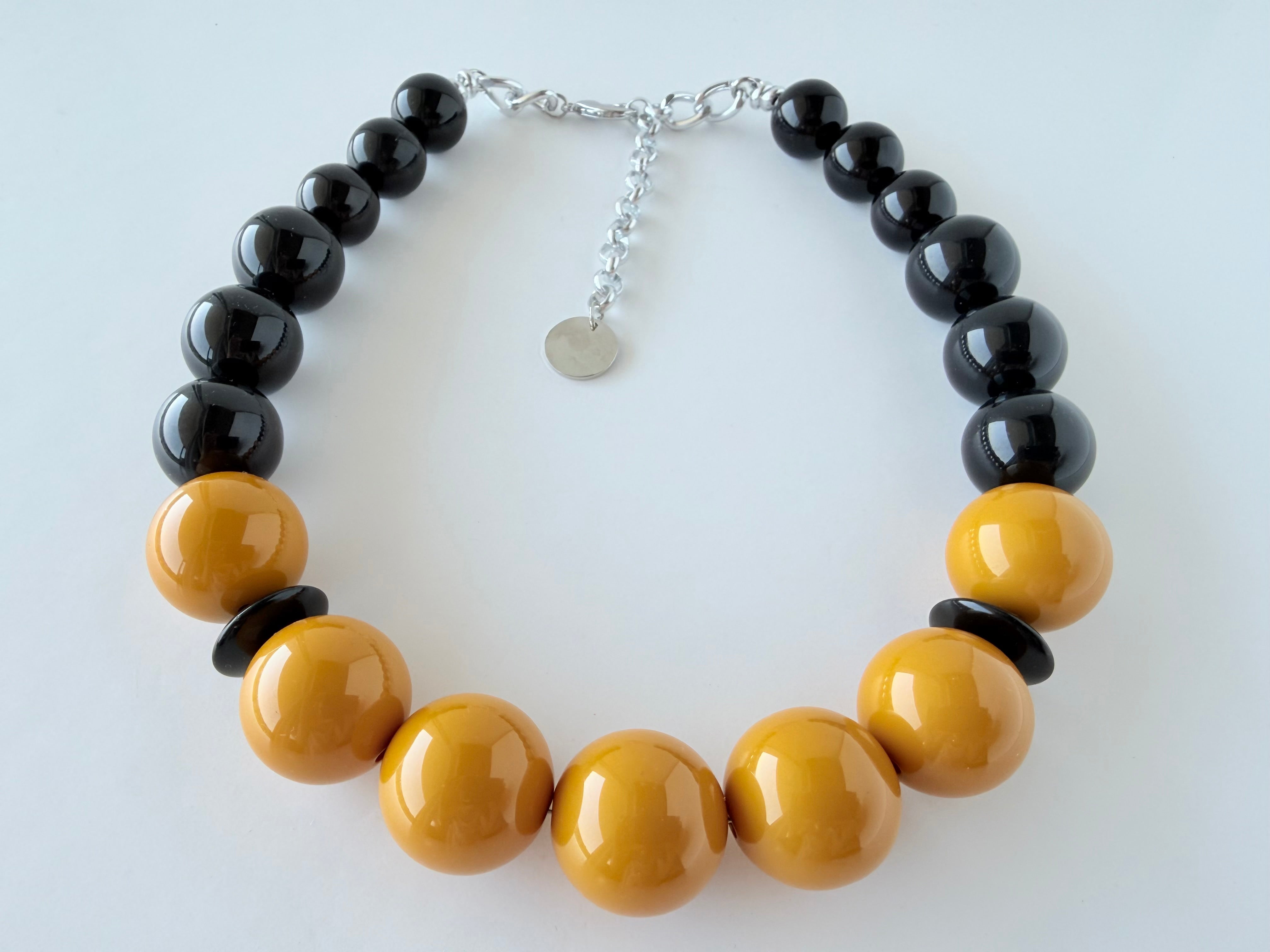 THE SEVENTY COLLECTION- 25 MM AMBER BLACK MARYLIN STATEMENT NECKLACE BY TESSA BIJOUX